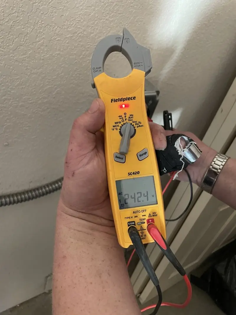 Voltage testing with clamp meter during Aluminum Wiring Replacement in Barre